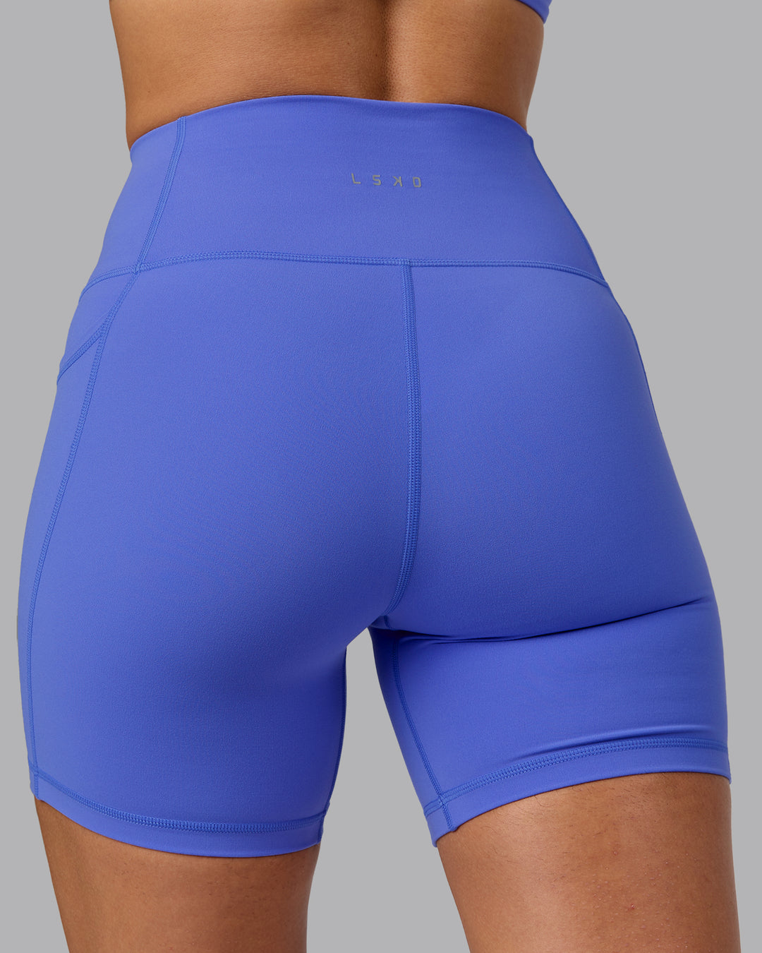 Woman wearing Fusion Ultra High-Rise 6" Short Pockets - Baja Blue | Model:Sophie | Size:S - view 7