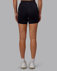 Woman wearing Fusion Ultra High-Rise 6" Short - Black | Set:true | Angle:back | Model:Hannah | Size:S | Thumbnail Index: 3