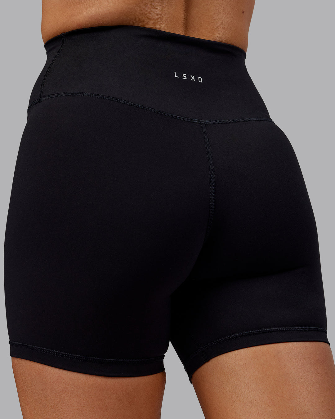Woman wearing Fusion Ultra High-Rise 6" Short - Black | Model:Hannah | Size:S - view 7