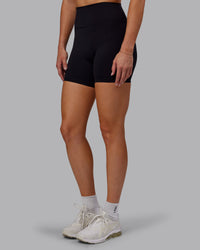 Woman wearing Fusion Ultra High-Rise 6" Short - Black | Set:true | Angle:side | Model:Hannah | Size:S | Thumbnail Index: 0
