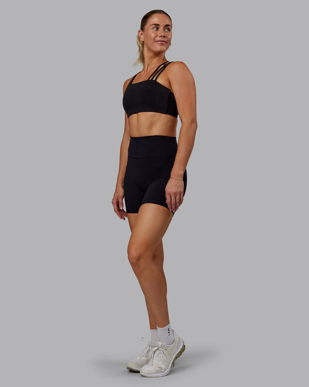 Woman wearing Fusion Ultra High-Rise 6" Short - Black | Model:Hannah | Size:S - view 5