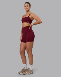 Woman wearing Fusion Ultra High-Rise 6" Short Pockets - Cordovan | Model:Chloe | Size:XS | Thumbnail Index: 3