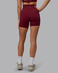 Woman wearing Fusion Ultra High-Rise 6" Short Pockets - Cordovan | Model:Chloe | Size:XS | Thumbnail Index: 4