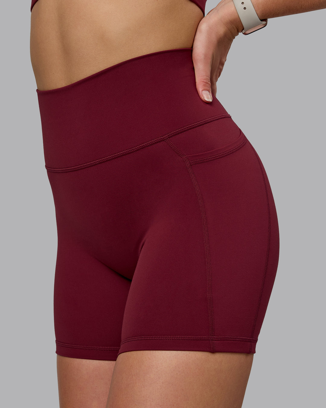 Woman wearing Fusion Ultra High-Rise 6" Short Pockets - Cordovan | Model:Chloe | Size:XS - view 6