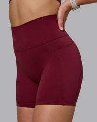 Woman wearing Fusion Ultra High-Rise 6" Short Pockets - Cordovan | Model:Chloe | Size:XS | Thumbnail Index: 5