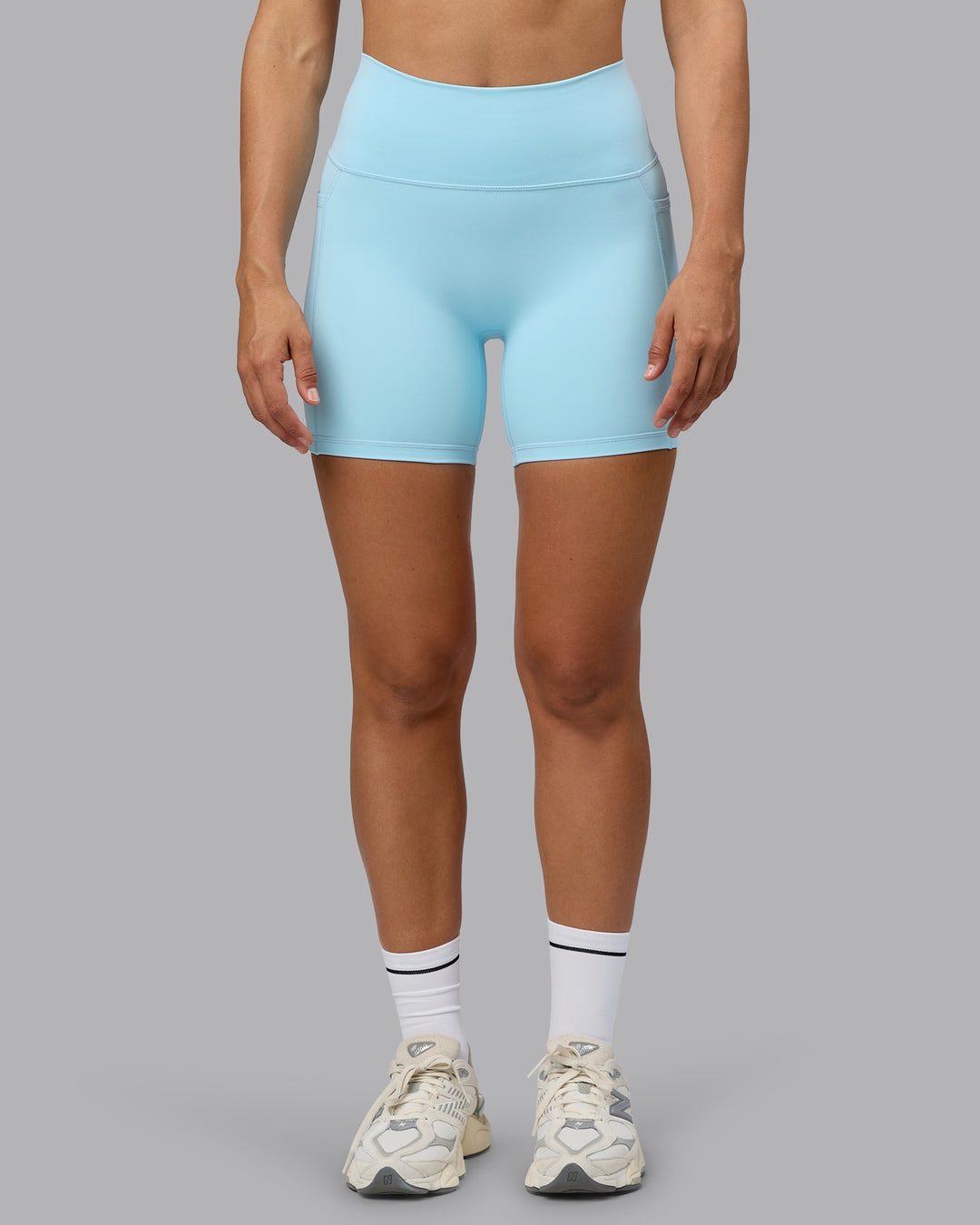 Woman wearing Fusion Ultra High-Rise 6" Short Pockets - Crystal Blue | Set:true | Angle:front | Model:Sophie | Size:S - view 8