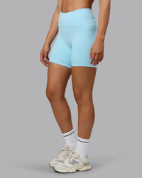 Woman wearing Fusion Ultra High-Rise 6" Short Pockets - Crystal Blue | Set:true | Angle:side | Model:Sophie | Size:S | Thumbnail Index: 5