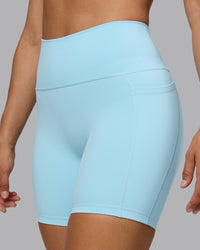 Woman wearing Fusion Ultra High-Rise 6" Short Pockets - Crystal Blue | Model:Sophie | Size:S | Thumbnail Index: 0