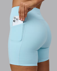 Woman wearing Fusion Ultra High-Rise 6" Short Pockets - Crystal Blue | Set:true | Angle:closeup | Model:Sophie | Size:S | Thumbnail Index: 4