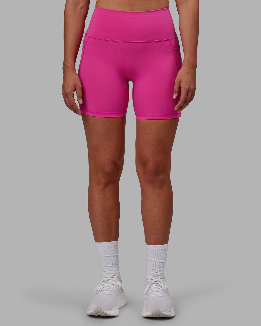 Woman wearing Fusion Ultra High-Rise 6" Short Pockets - Fuchsia Pink | Set:true | Angle:front | Model:Sophie | Size:S - view 9