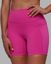 Woman wearing Fusion Ultra High-Rise 6" Short Pockets - Fuchsia Pink | Model:Sophie | Size:S | Thumbnail Index: 4