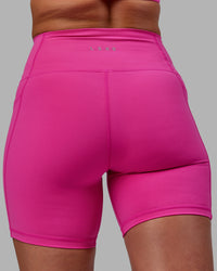 Woman wearing Fusion Ultra High-Rise 6" Short Pockets - Fuchsia Pink | Model:Sophie | Size:S | Thumbnail Index: 7