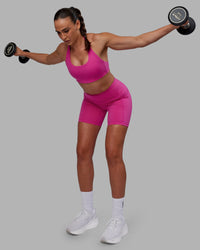 Woman wearing Fusion Ultra High-Rise 6" Short Pockets - Fuchsia Pink | Model:Sophie | Size:S | Thumbnail Index: 6