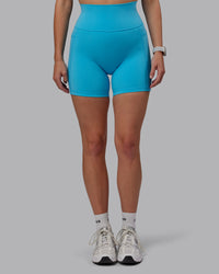 Woman wearing Fusion Ultra High-Rise 6" Short Pockets - Pacific Blue | Model:Lillie | Size:S | Thumbnail Index: 6