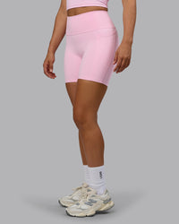 Woman wearing Fusion Ultra High-Rise 6" Short Pockets - Pale Pink | Model:Sophie | Size:S | Thumbnail Index: 0