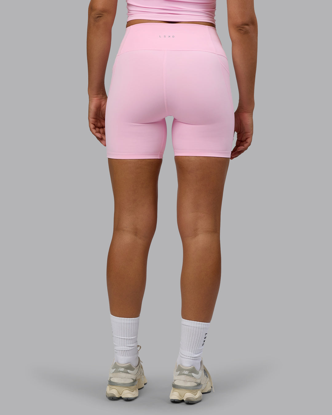 Woman wearing Fusion Ultra High-Rise 6" Short Pockets - Pale Pink | Model:Sophie | Size:S - view 3