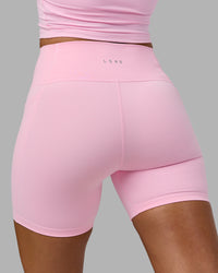 Woman wearing Fusion Ultra High-Rise 6" Short Pockets - Pale Pink | Model:Sophie | Size:S | Thumbnail Index: 6