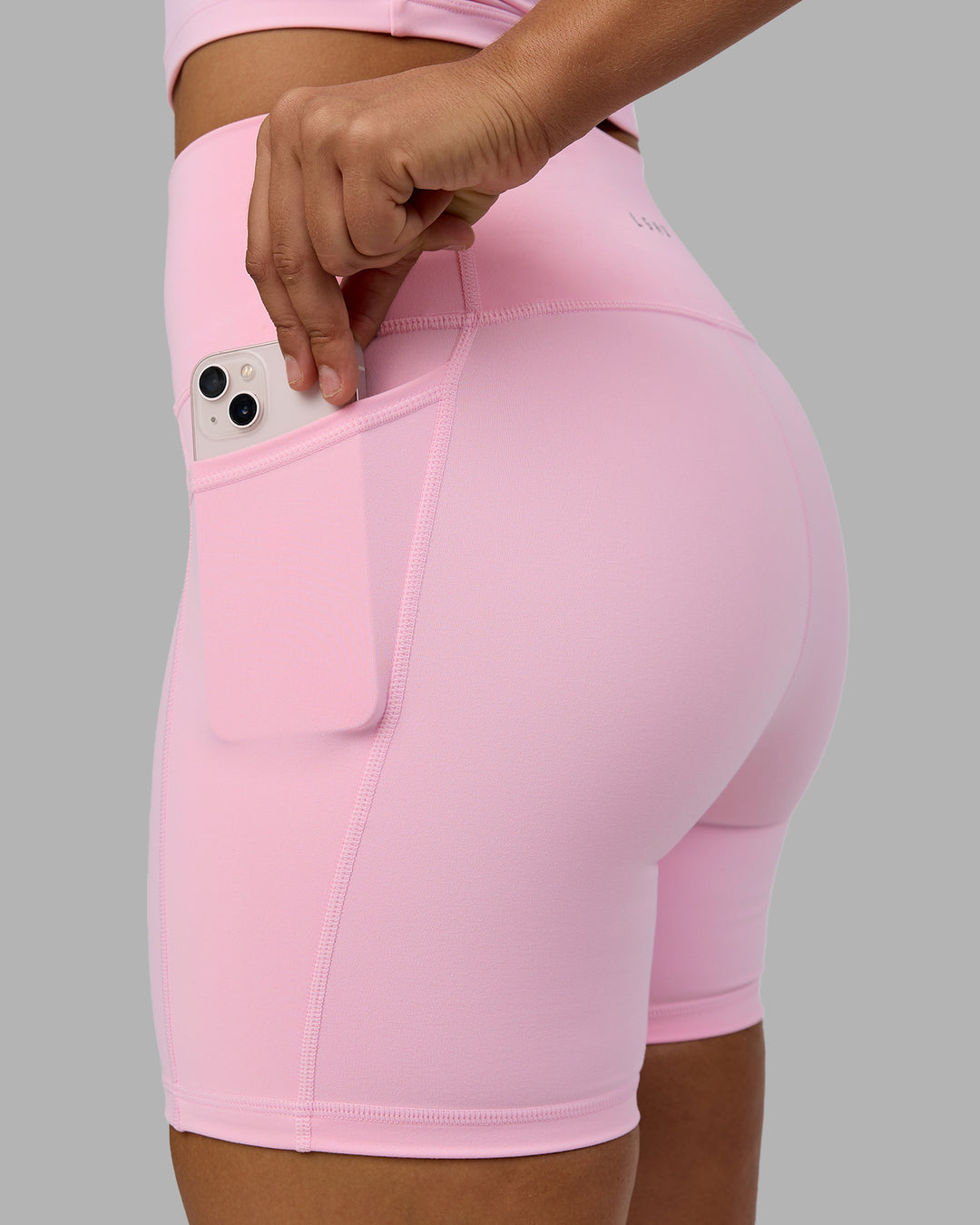 Woman wearing Fusion Ultra High-Rise 6" Short Pockets - Pale Pink | Model:Sophie | Size:S - view 6