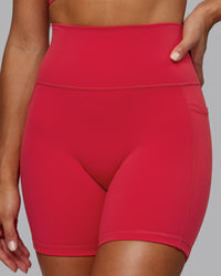 Woman wearing Fusion Ultra High-Rise 6" Short Pockets - Scarlet | Model:Demi | Size:S | Thumbnail Index: 0