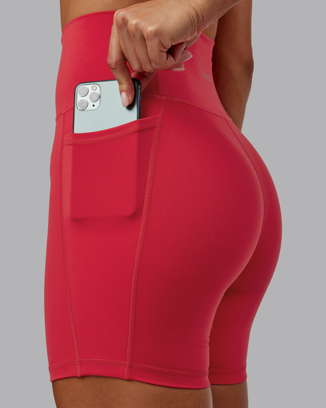 Woman wearing Fusion Ultra High-Rise 6" Short Pockets - Scarlet | Model:Demi | Size:S - view 4