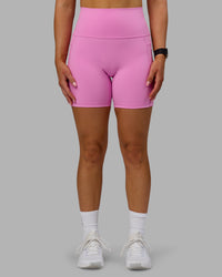 Woman wearing Fusion Ultra High-Rise 6" Short Pockets - Spark Pink | Model:Halle | Size:S | Thumbnail Index: 7