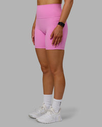 Woman wearing Fusion Ultra High-Rise 6" Short Pockets - Spark Pink | Model:Halle | Size:S | Thumbnail Index: 5