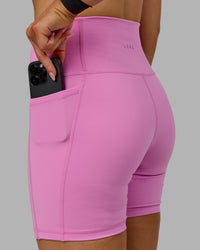 Woman wearing Fusion Ultra High-Rise 6" Short Pockets - Spark Pink | Model:Halle | Size:S | Thumbnail Index: 4