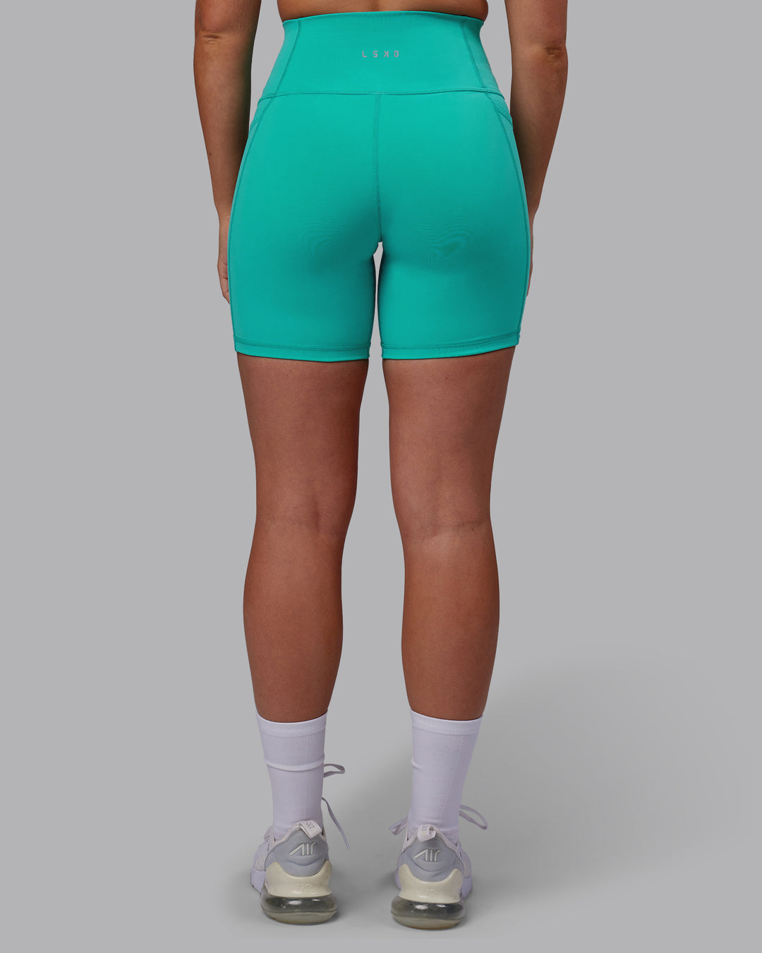 Woman wearing Fusion Ultra High-Rise 6" Short Pockets - Turquoise Tide | Model:Hannah | Size:S - view 3