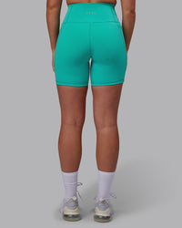 Woman wearing Fusion Ultra High-Rise 6" Short Pockets - Turquoise Tide | Model:Hannah | Size:S | Thumbnail Index: 2