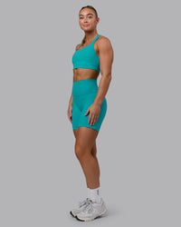 Woman wearing Fusion Ultra High-Rise 6" Short Pockets - Uplift Blue | Model:Monique | Size:S | Thumbnail Index: 3