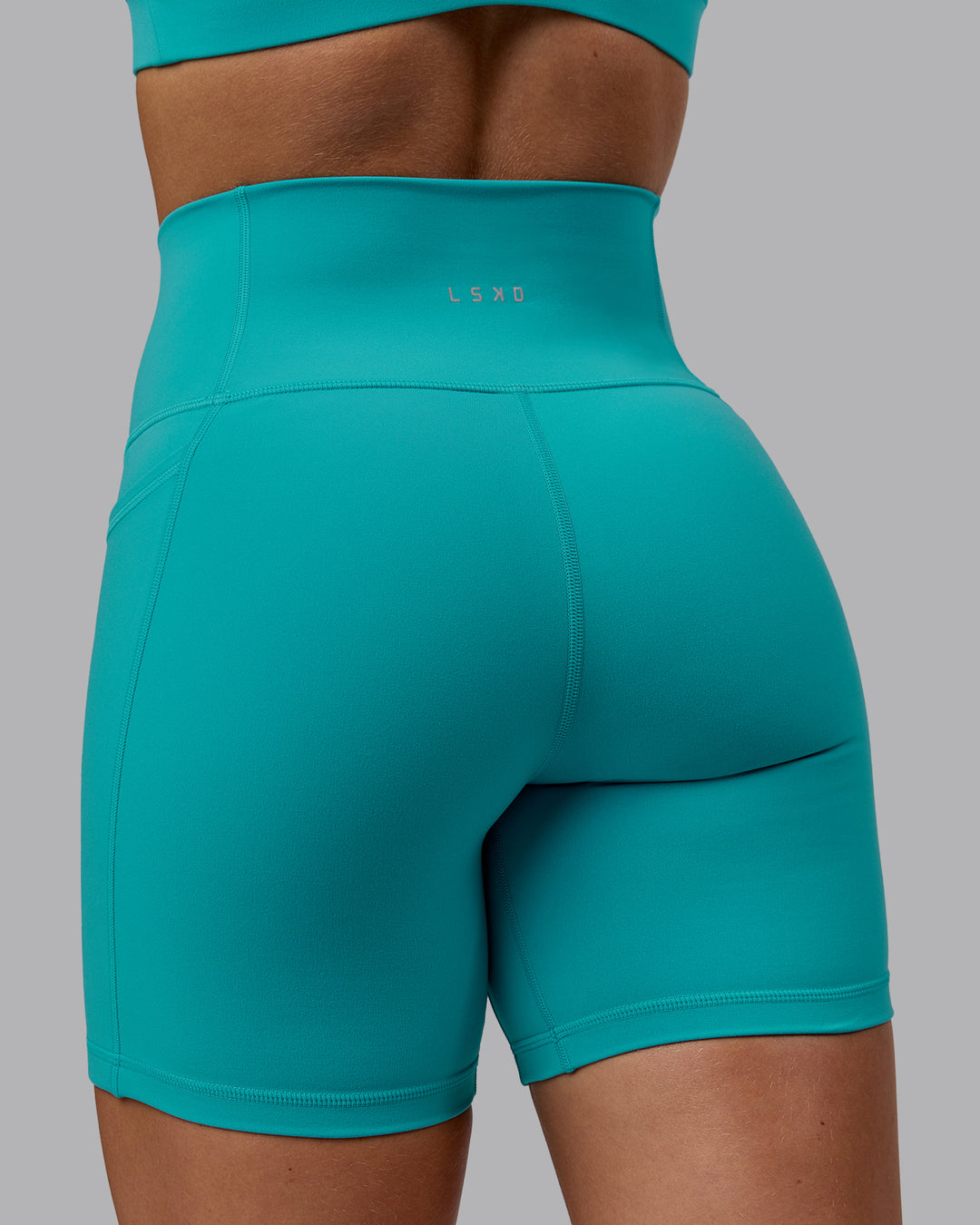 Woman wearing Fusion Ultra High-Rise 6" Short Pockets - Uplift Blue | Model:Monique | Size:S - view 8