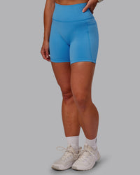 Woman wearing Fusion Ultra High-Rise 6" Short Pockets - Azure Blue | Model:Amber | Size:S | Thumbnail Index: 0