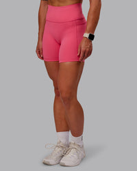 Woman wearing Fusion Ultra High-Rise 6" Short Pockets - Hot Pink | Model:Amber | Size:S | Thumbnail Index: 0