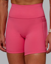 Woman wearing Fusion Ultra High-Rise 6" Short Pockets - Hot Pink | Model:Amber | Size:S | Thumbnail Index: 5