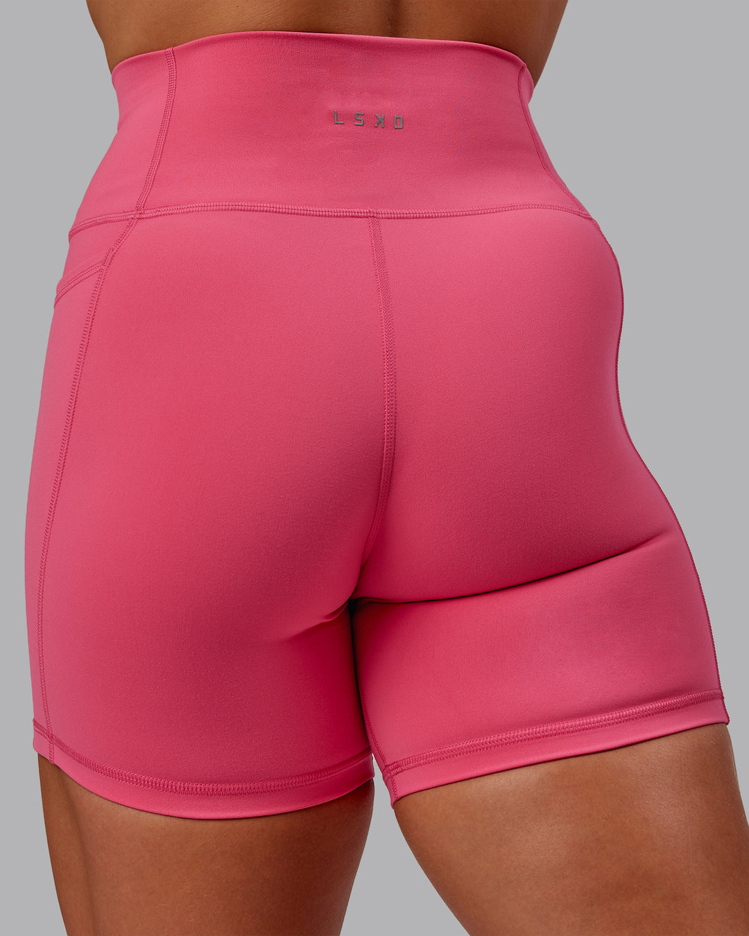 Woman wearing Fusion Ultra High-Rise 6" Short Pockets - Hot Pink | Model:Amber | Size:S - view 8