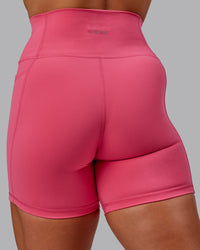 Woman wearing Fusion Ultra High-Rise 6" Short Pockets - Hot Pink | Model:Amber | Size:S | Thumbnail Index: 7