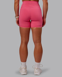 Woman wearing Fusion Ultra High-Rise 6" Short Pockets - Hot Pink | Model:Amber | Size:S | Thumbnail Index: 3