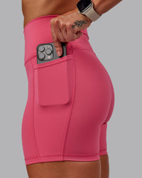 Woman wearing Fusion Ultra High-Rise 6" Short Pockets - Hot Pink | Model:Amber | Size:S | Thumbnail Index: 2