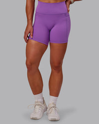 Woman wearing Fusion Ultra High-Rise 6" Short Pockets - Purple Fizz | Set:true | Angle:front | Model:Amber | Size:S | Thumbnail Index: 6