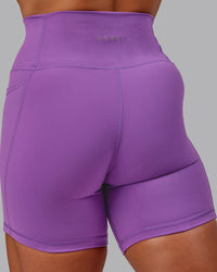 Woman wearing Fusion Ultra High-Rise 6" Short Pockets - Purple Fizz | Model:Amber | Size:S | Thumbnail Index: 7