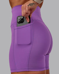 Woman wearing Fusion Ultra High-Rise 6" Short Pockets - Purple Fizz | Set:true | Angle:closeup | Model:Amber | Size:S | Thumbnail Index: 5