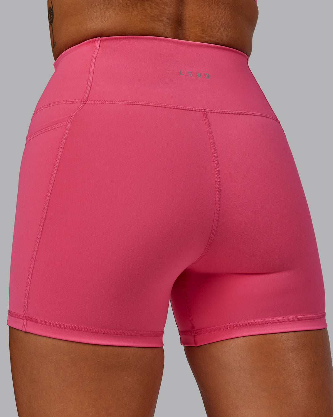 Woman wearing Fusion Ultra High-Rise 4" Short Pockets - Hot Pink | Model:Vanessa | Size:S - view 7