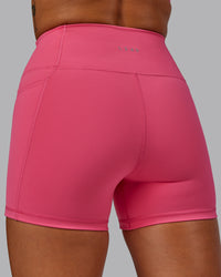 Woman wearing Fusion Ultra High-Rise 4" Short Pockets - Hot Pink | Model:Vanessa | Size:S | Thumbnail Index: 6