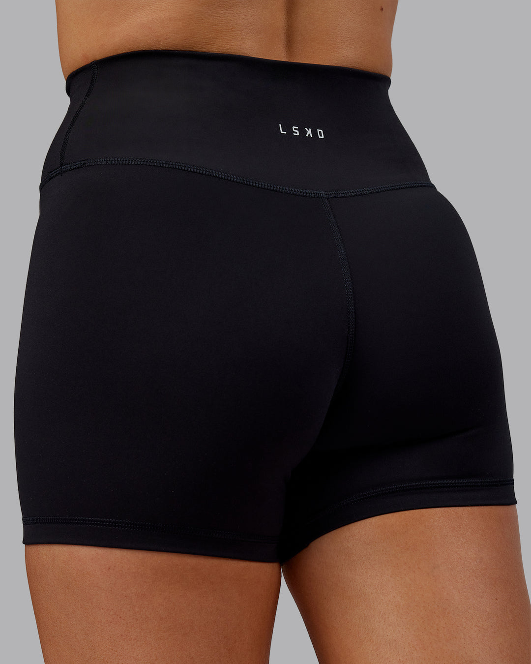 Woman wearing Fusion Ultra High-Rise 4" Short - Black | Model:Hannah | Size:S - view 7