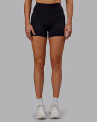 Woman wearing Fusion Ultra High-Rise 4" Short - Black | Set:true | Angle:front | Model:Hannah | Size:S | Thumbnail Index: 4