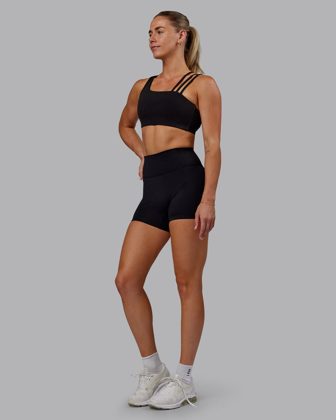 Woman wearing Fusion Ultra High-Rise 4" Short - Black | Model:Hannah | Size:S - view 8