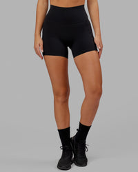 Woman wearing O.G. Fusion Ultra High-Rise 4" Short Pockets - Black | Model:Milly | Size:S | Thumbnail Index: 8