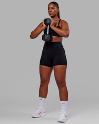 Woman wearing O.G. Fusion Ultra High-Rise 4" Short Pockets - Black | Model:Sierra | Size:L | Thumbnail Index: 6