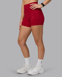 Woman wearing Fusion Ultra High-Rise 4" Short Pockets - Cherry Red | Model:Halle | Size:S | Thumbnail Index: 5