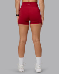 Woman wearing Fusion Ultra High-Rise 4" Short Pockets - Cherry Red | Model:Halle | Size:S | Thumbnail Index: 2